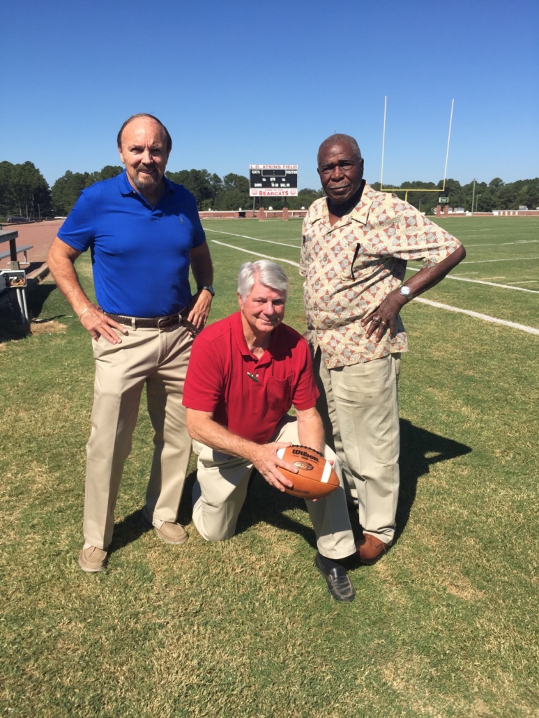 These former Forest High School football coaches led the 1970 Bearcats - the first integrated team in school history - to a perfect 11-0 season and an Overall Little Dixie Conference title. From left are Billy Ray Dill, Gary Risher (now deceased) and James “Bo” Clark (also deceased), shown in 2016 on L.O. Atkins Field, where the championship game was held nearly 50 years ago. (Photo by Bubby Johnston)